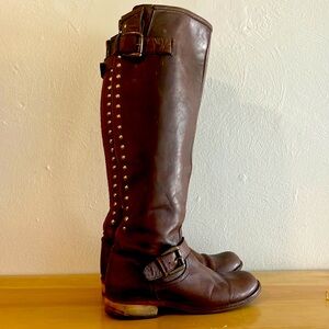 Knee-high, brown leather slip up back Steve Madden boots